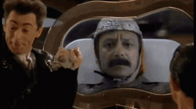 Man Wearing Helmet Looking At Another GIF