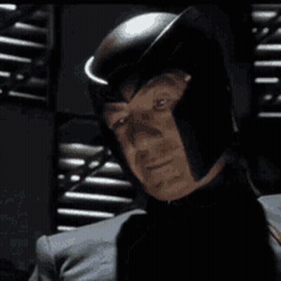 Man Wearing Helmet Looking At Camera GIF