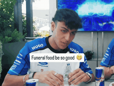 Man Wearing Hugo Shirt Eating GIF