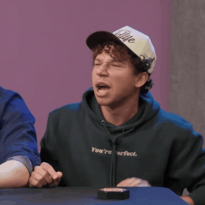 Man Wearing I'm Sitting Hat At Table GIF