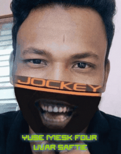 Man Wearing Jockey Mask Smiling GIF
