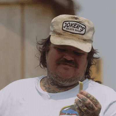 Man Wearing Joker's Skate Shop Hat GIF