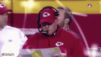 Man Wearing KS Hat And Headphones Holding Paper GIF