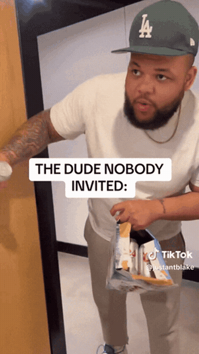 Man Wearing LA Hat Holding Chips GIF