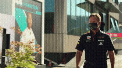 Man Wearing Mask In Front Of Hamilton Building GIF