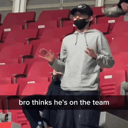 Man Wearing Mask In Stadium With Bro Thinks He's On The Team GIF