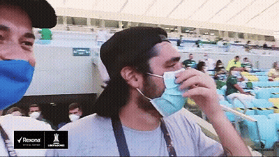 Man Wearing Mask In Stadium With Rexona Logo GIF