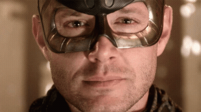 Man Wearing Mask Looking At Camera GIF