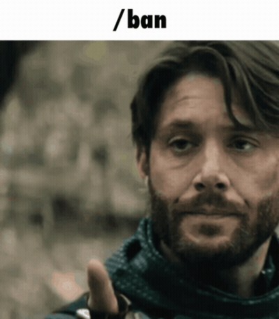 Man Wearing Mask Looks At Camera GIF