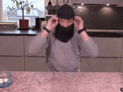 Man Wearing Mask Next To Candle GIF