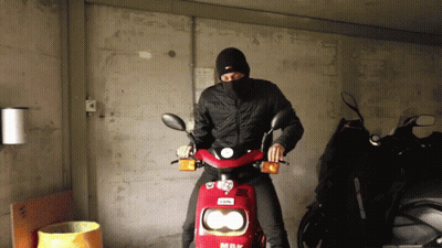 Man Wearing Mask Riding Red Scooter GIF