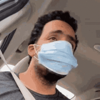 Man Wearing Mask Sitting In Car GIF
