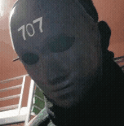Man Wearing Mask With Number 707 GIF