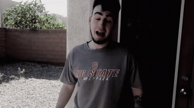 Man Wearing NC State Wolfpack Shirt