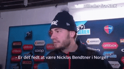 Man Wearing Nike Beanie In Front Of Bildeder Fra Nrk Sign GIF
