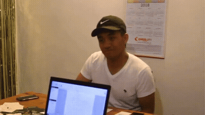 Man Wearing Nike Hat At Desk GIF