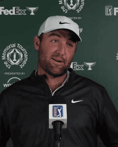 Man Wearing Nike Hat In Front Of FedEx GIF