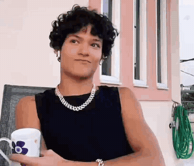 Man Wearing Pearl Necklace And Earrings GIF