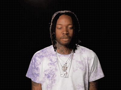 Man Wearing Purple Tie Dye Shirt And Cam Necklace GIF