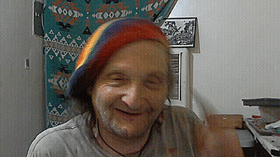 Man Wearing Rainbow Hat Smiling GIF