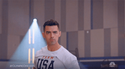 Man Wearing Shirt Saying USA GIF