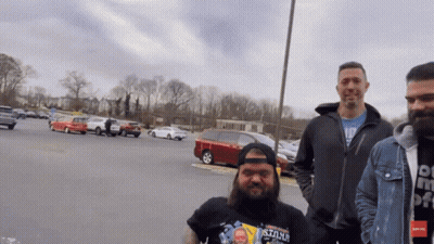 Man Wearing Stone Shirt In Parking Lot GIF