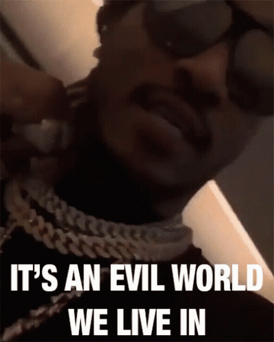 Man Wearing Sunglasses And Chain Says Evil World GIF
