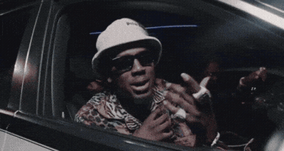 Man Wearing Sunglasses And Hat In Car GIF