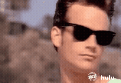 Man Wearing Sunglasses And Hulu Logo GIF