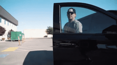 Man Wearing Sunglasses Getting Out Of Car GIF