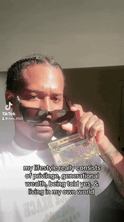 Man Wearing Sunglasses Holding Lottery Ticket GIF
