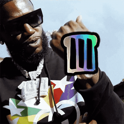 Man Wearing Sunglasses Holding Sticker GIF