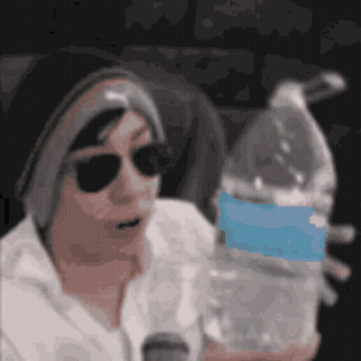 Man Wearing Sunglasses Holding Water Bottle GIF