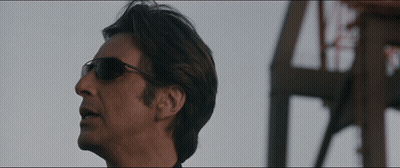Man Wearing Sunglasses In Front Of Building GIF