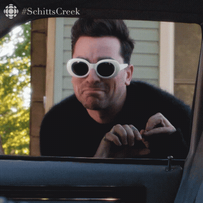 Man Wearing Sunglasses Looking Out Car Window GIF