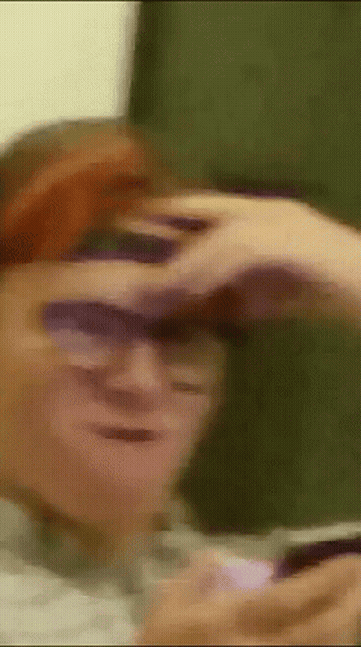 Man Wearing Sunglasses Looking Through Binoculars GIF
