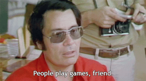 Man Wearing Sunglasses Saying People Play Games GIF