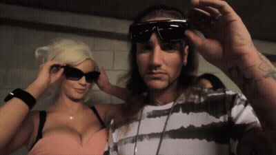 Man Wearing Sunglasses Sitting At Table GIF
