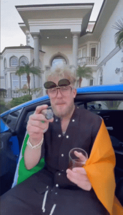 Man Wearing Sunglasses Sitting In Car GIF