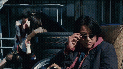 Man Wearing Sunglasses Sitting In Chair GIF