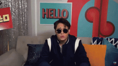 Man Wearing Sunglasses Sitting On Couch GIF