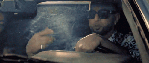 Man Wearing Sunglasses Smoking Cigarette GIF