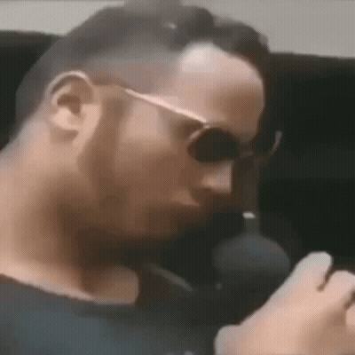 Man Wearing Sunglasses Talking On Phone GIF