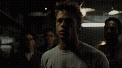 Man Wearing T-Shirt With Letter K In Crowd GIF