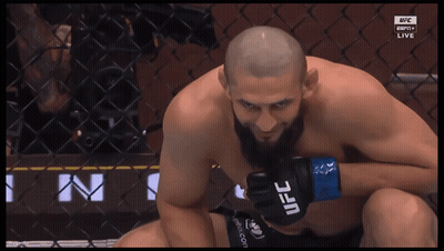 Man Wearing UFC Gloves Looking Down GIF