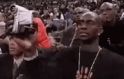 Man Wearing VR Headset In Crowd GIF