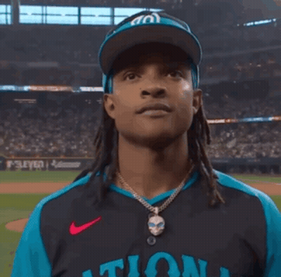 Man Wearing W Hat And Nationals Jersey GIF