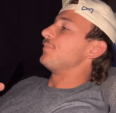 Man Wearing White Hat With Infinity Symbol GIF