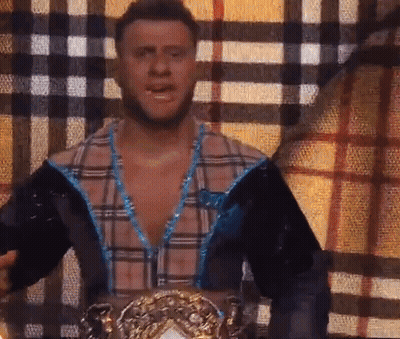 Man Wearing Wrestling Belt Interviewed By Woman GIF