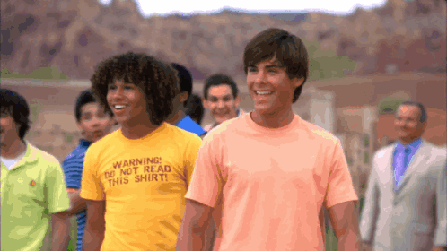 Man Wearing Yellow Warning Do Not Read This Shirt GIF